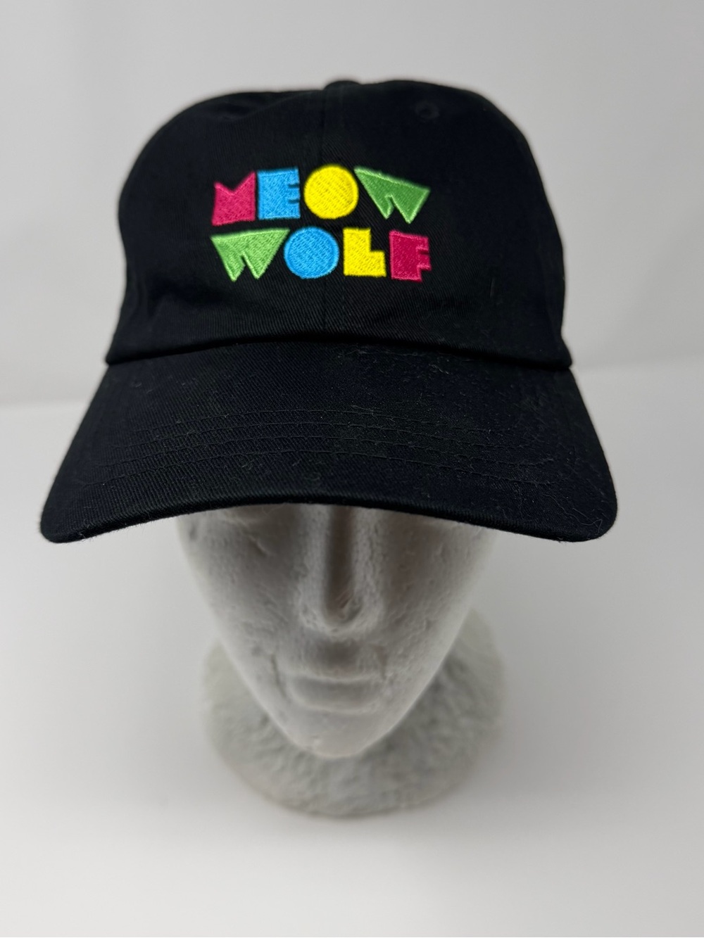 The Classic Black Baseball Cap with Neon Multi-Color Embroidered 'MEOW WOLF'